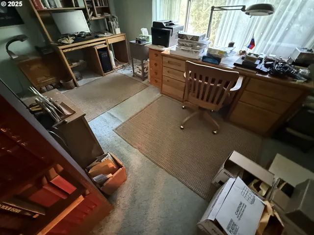 a view of a workspace with furniture