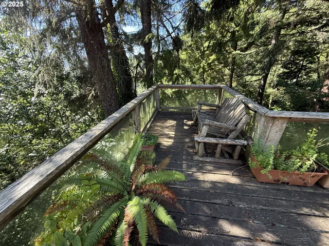 a view of a house with backyard porch and sitting area