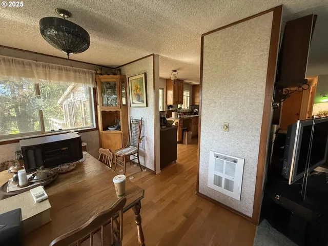 a kitchen with stainless steel appliances a refrigerator and a stove top oven
