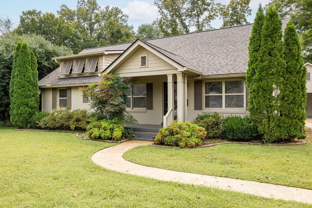 439 East Madison Street Pulaski, TN 38478 - Photo 1 of 36 a front view of a house with garden