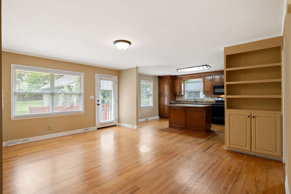 439 East Madison Street Pulaski, TN 38478 - Photo 16 of 36 a kitchen with stainless steel appliances kitchen island wooden cabinets and granite counter tops