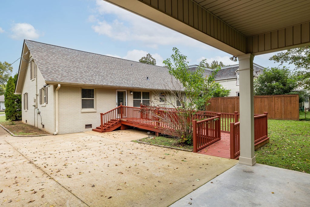 439 East Madison Street Pulaski, TN 38478 - Photo 7 of 36 a front view of a house with a yard garage and outdoor seating