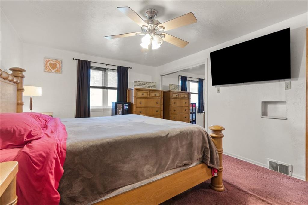 7826 Noblestown Road McDonald, PA 15057 - Photo 14 of 48 a bedroom with a bed and a flat screen tv