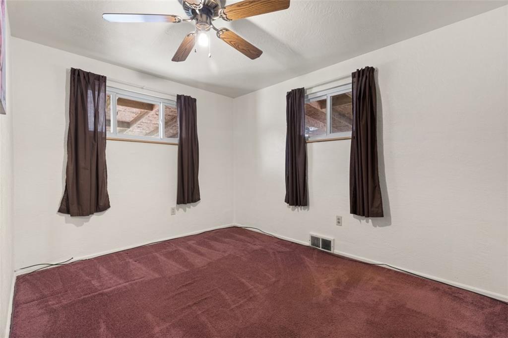 7826 Noblestown Road McDonald, PA 15057 - Photo 16 of 48 a bedroom with a bed and a painting on the wall