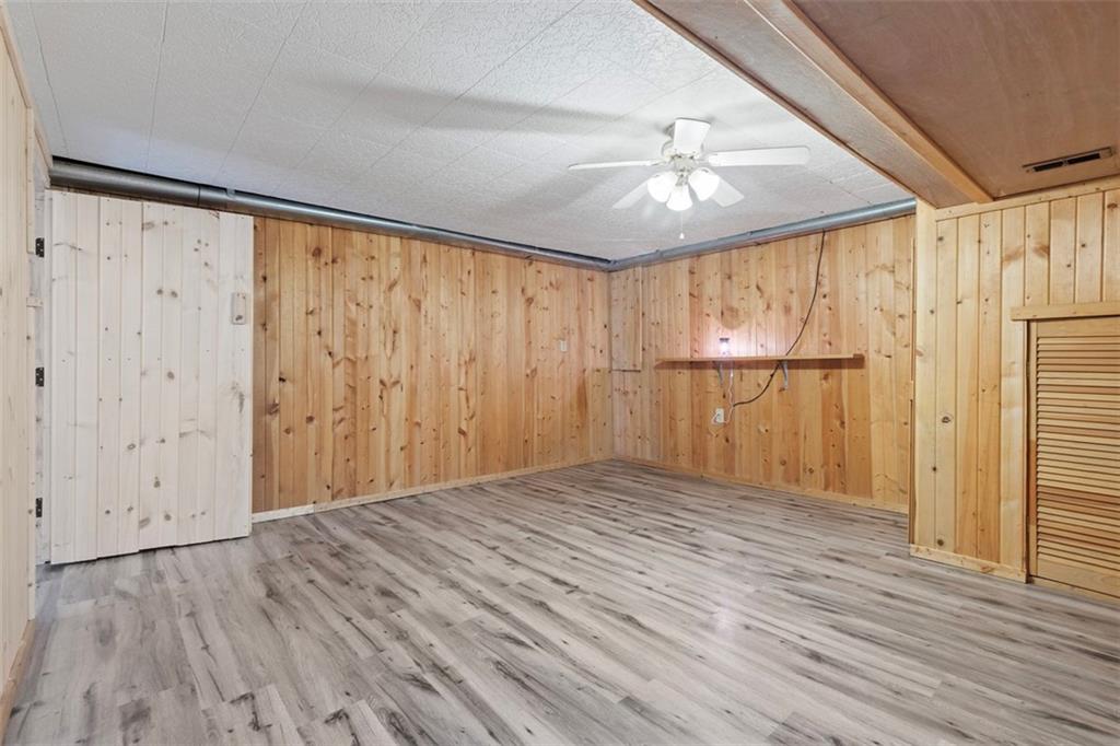 7826 Noblestown Road McDonald, PA 15057 - Photo 20 of 48 a view of empty room with wooden floor and fan