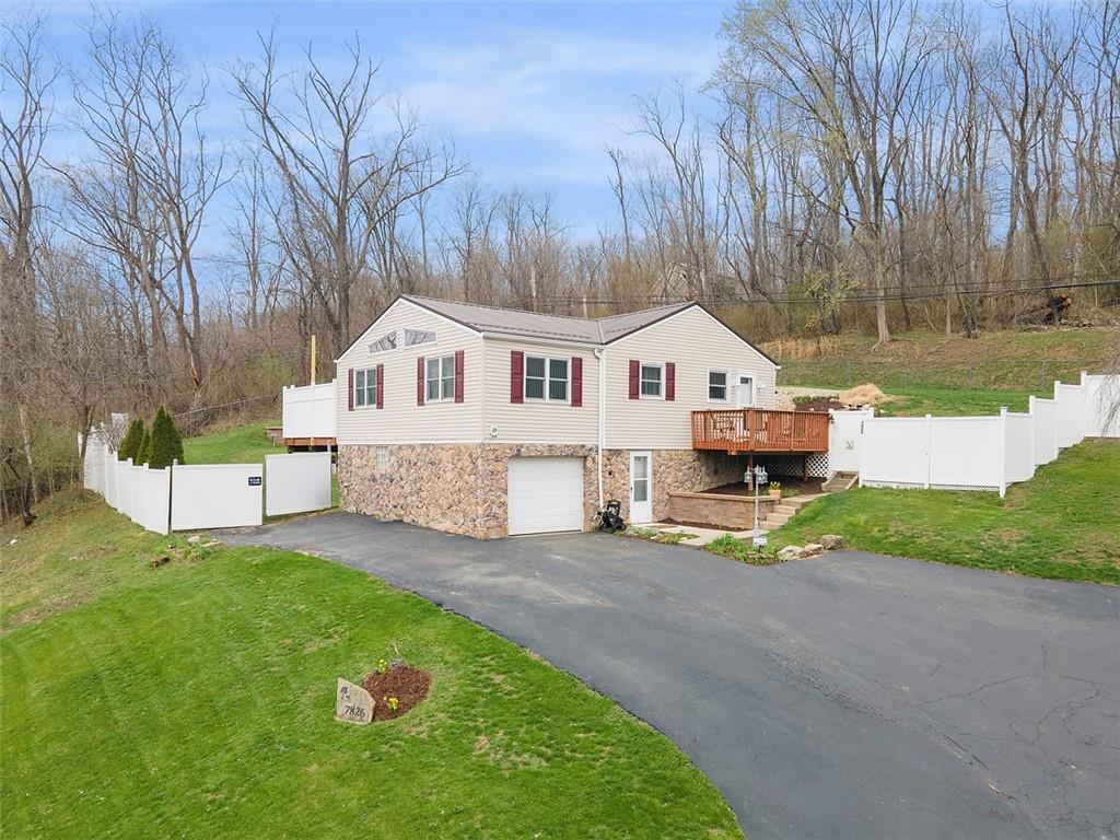 7826 Noblestown Road McDonald, PA 15057 - Photo 2 of 48 a front view of a house with a yard and fence