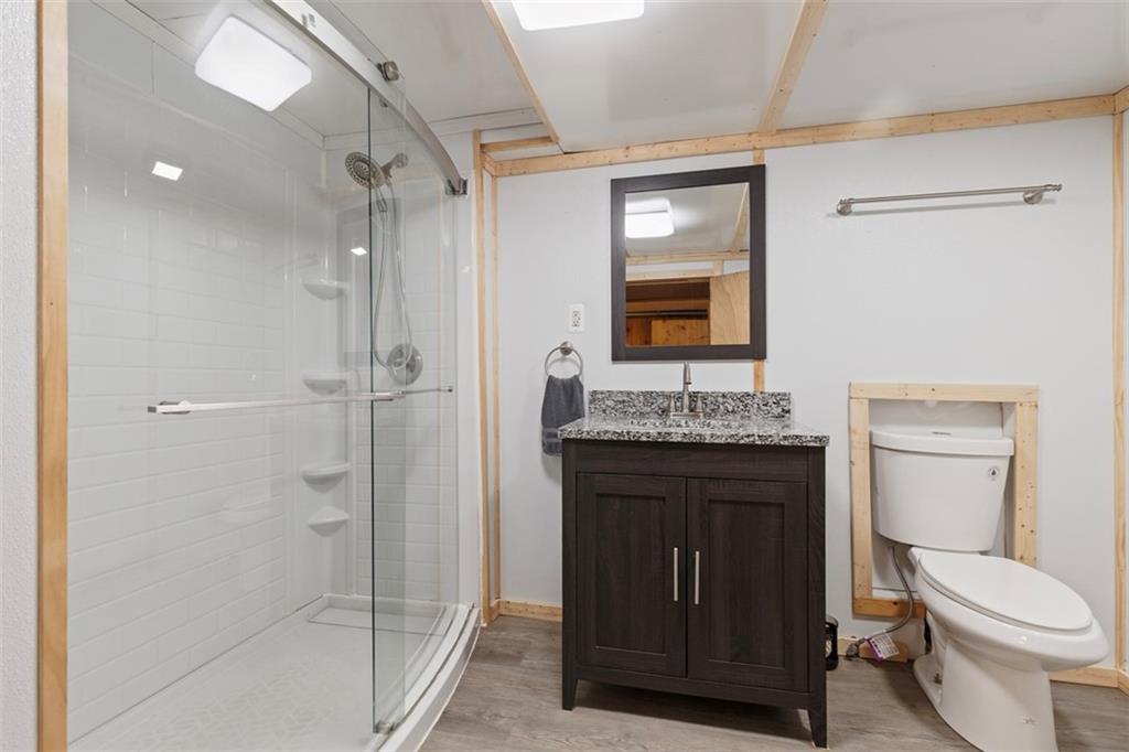 7826 Noblestown Road McDonald, PA 15057 - Photo 22 of 48 a bathroom with a granite countertop sink toilet and shower