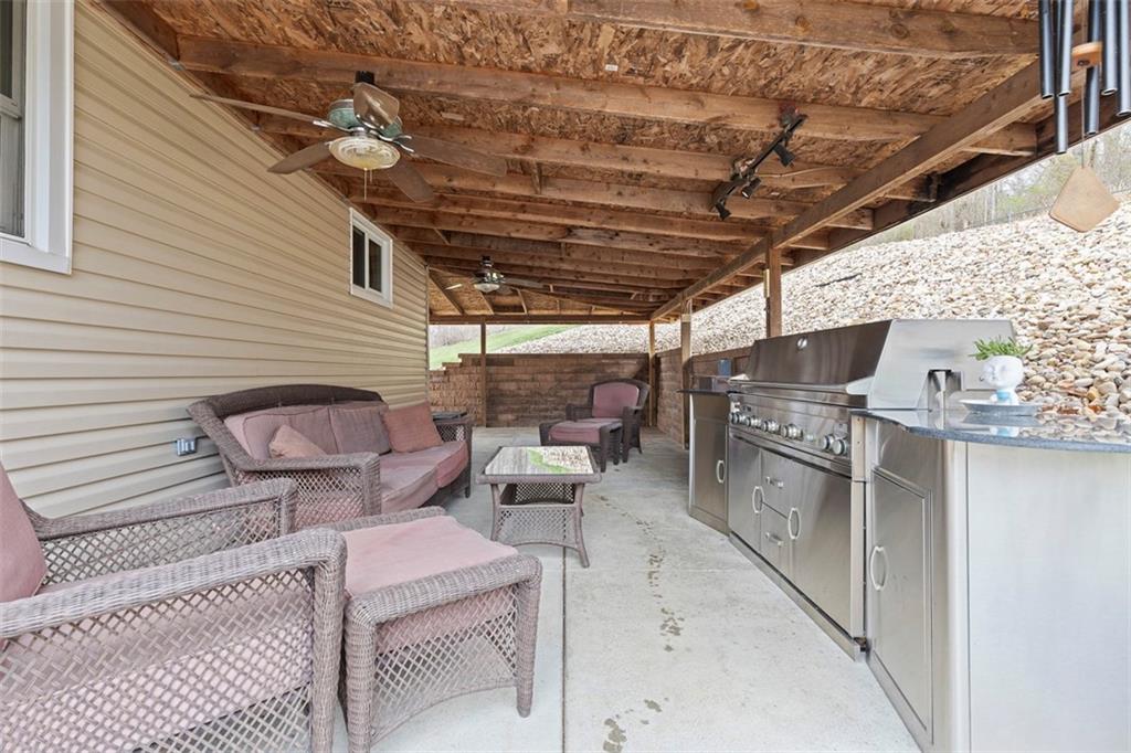 7826 Noblestown Road McDonald, PA 15057 - Photo 28 of 48 a backyard of a house with barbeque oven table and chairs