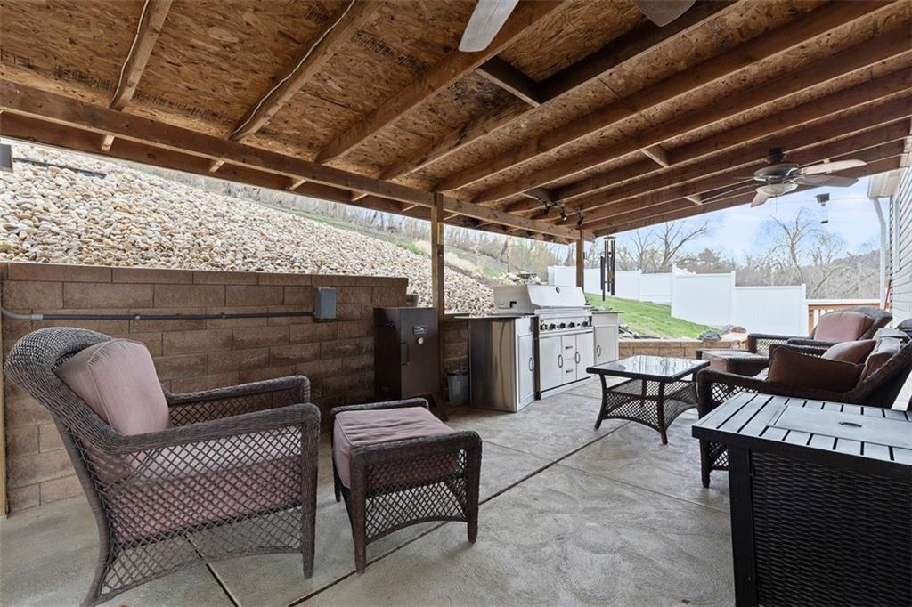 7826 Noblestown Road McDonald, PA 15057 - Photo 29 of 48 a view of a chairs and table in the back yard of a house