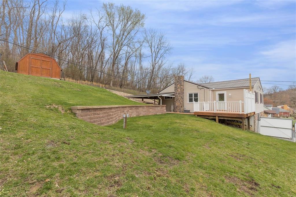 7826 Noblestown Road McDonald, PA 15057 - Photo 35 of 48 a view of a house with backyard and a tree