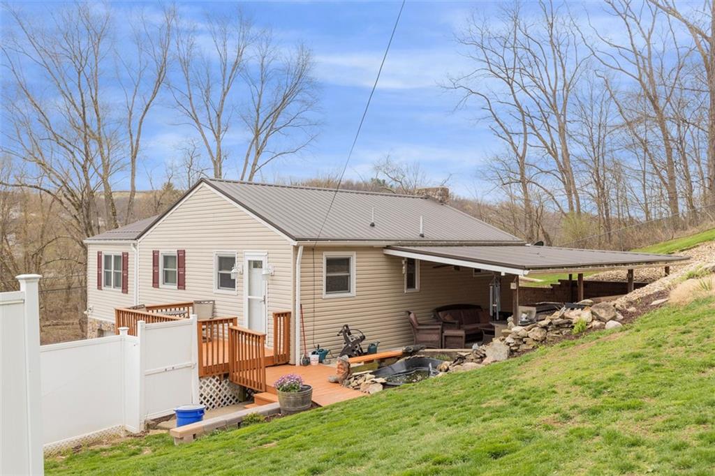 7826 Noblestown Road McDonald, PA 15057 - Photo 39 of 48 a backyard of a house with table and chairs