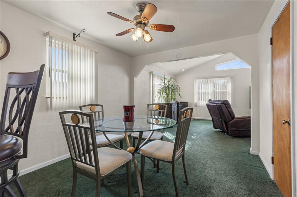 7826 Noblestown Road McDonald, PA 15057 - Photo 7 of 48 a view of a dining room with furniture and a chandelier