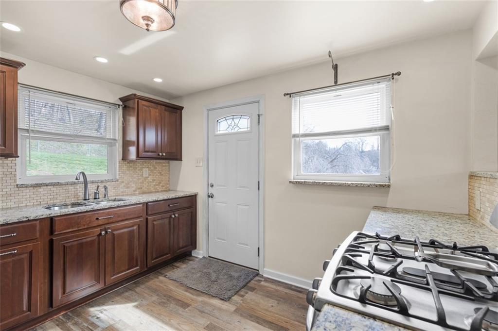 7826 Noblestown Road McDonald, PA 15057 - Photo 8 of 48 a kitchen with a stove and a sink