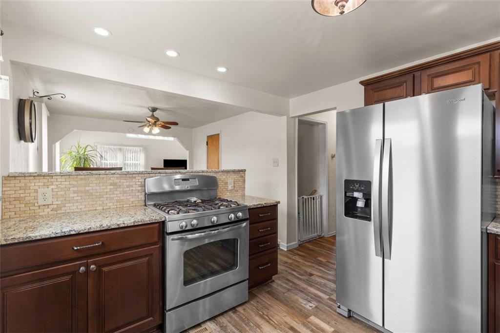 7826 Noblestown Road McDonald, PA 15057 - Photo 10 of 48 a kitchen with stainless steel appliances granite countertop a refrigerator and a sink