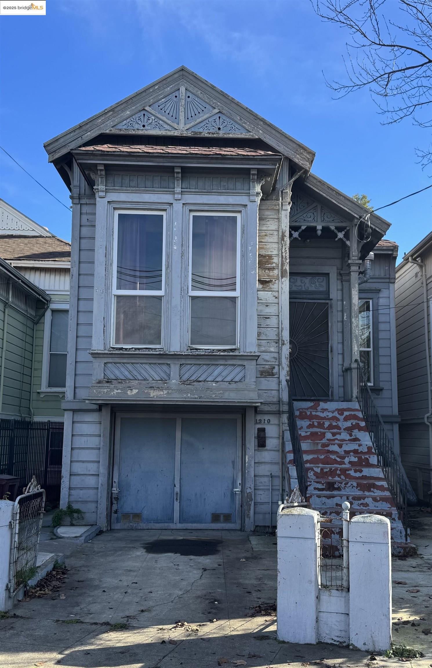 a front view of a house with garage