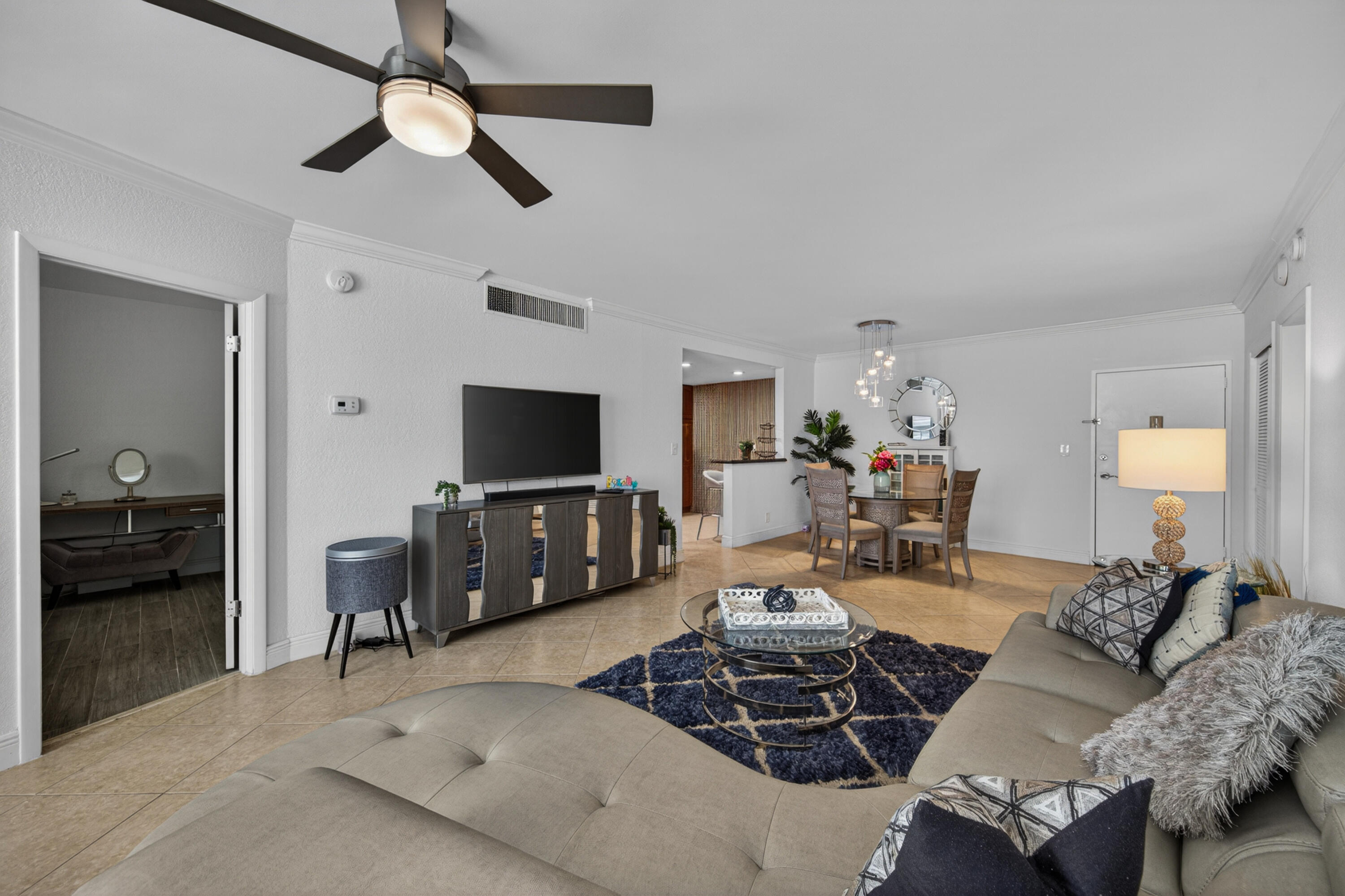 2851 South Ocean Boulevard, Unit 1N Boca Raton, FL 33432 - Photo 15 of 54 a living room with furniture and a flat screen tv
