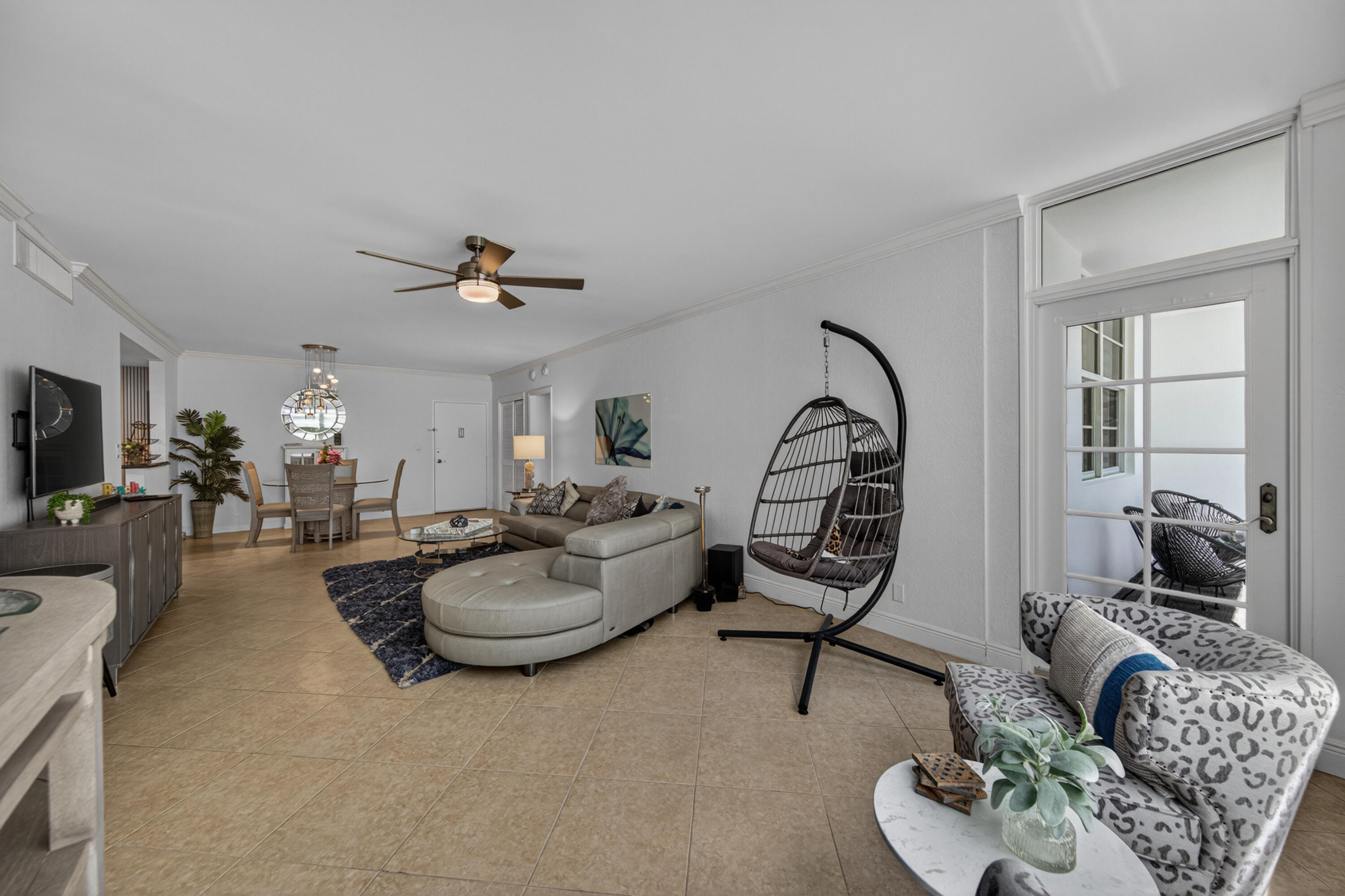 2851 South Ocean Boulevard, Unit 1N Boca Raton, FL 33432 - Photo 20 of 54 a living room with furniture and a flat screen tv