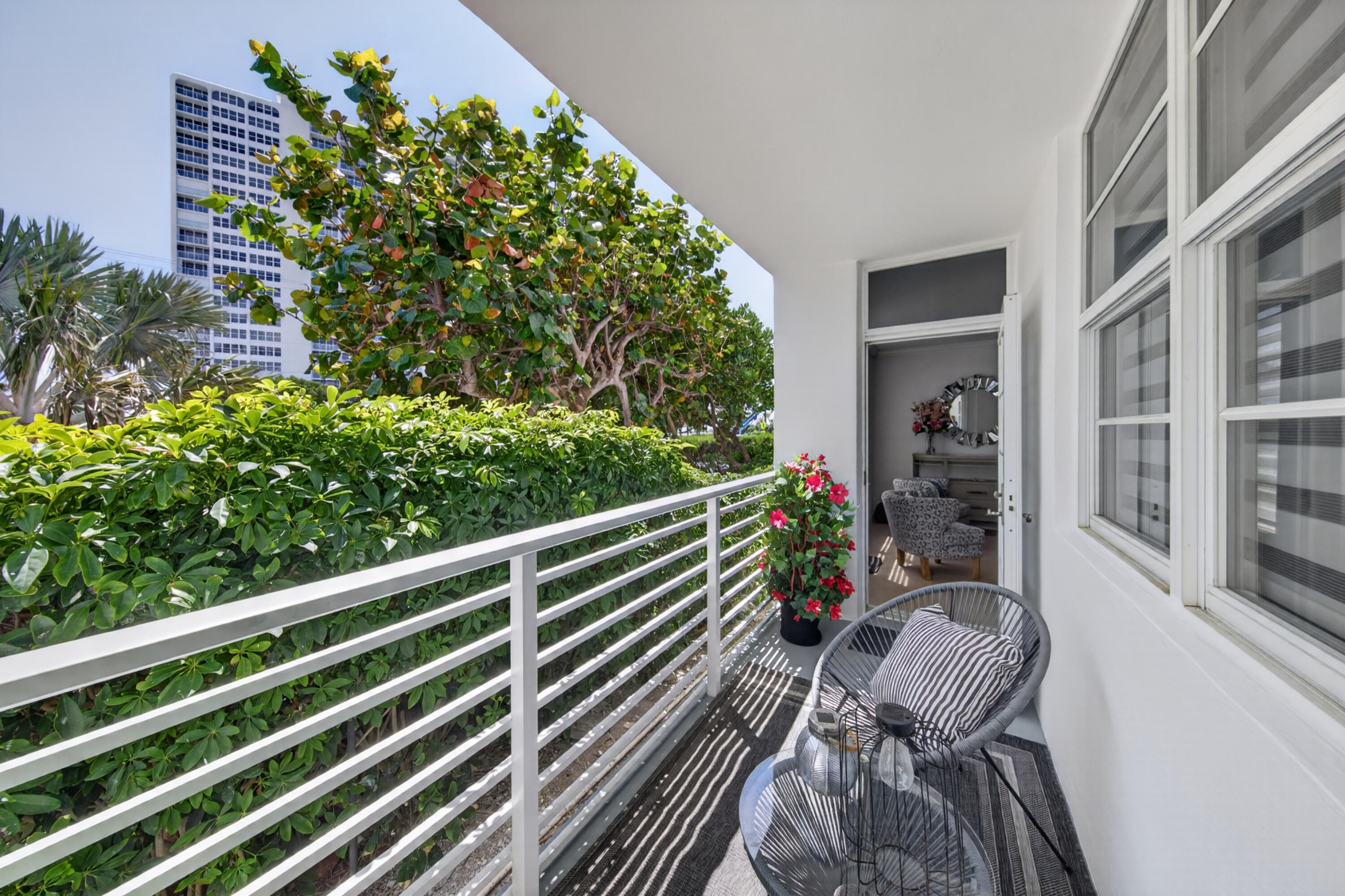 2851 South Ocean Boulevard, Unit 1N Boca Raton, FL 33432 - Photo 22 of 54 a view of a chairs and table in a balcony