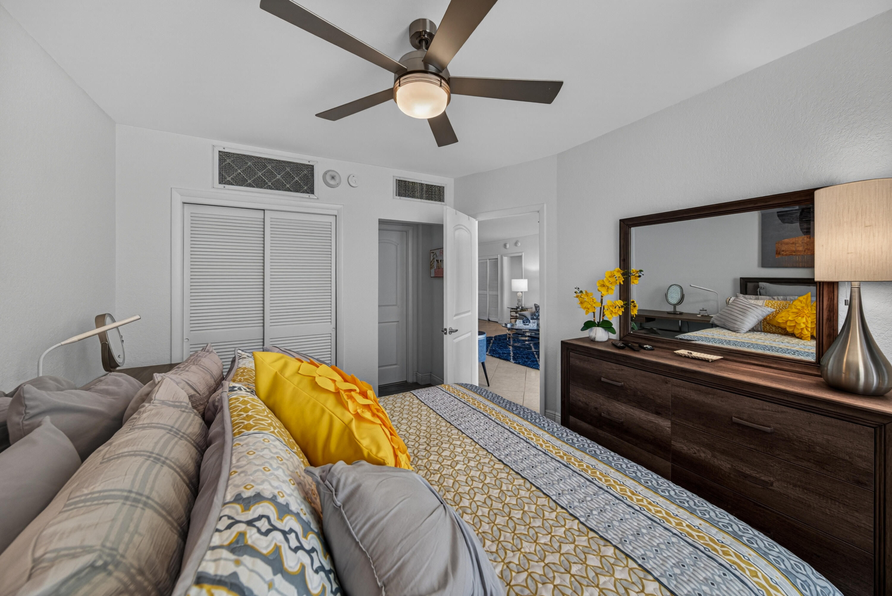 2851 South Ocean Boulevard, Unit 1N Boca Raton, FL 33432 - Photo 26 of 54 a bedroom with a bed and wooden floor