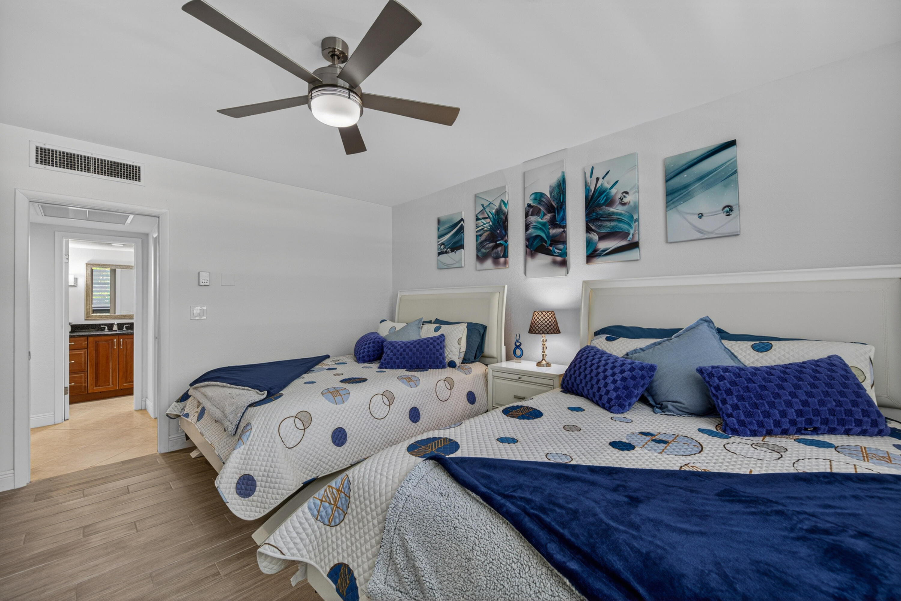 2851 South Ocean Boulevard, Unit 1N Boca Raton, FL 33432 - Photo 29 of 54 a bedroom with a bed and ceiling fan