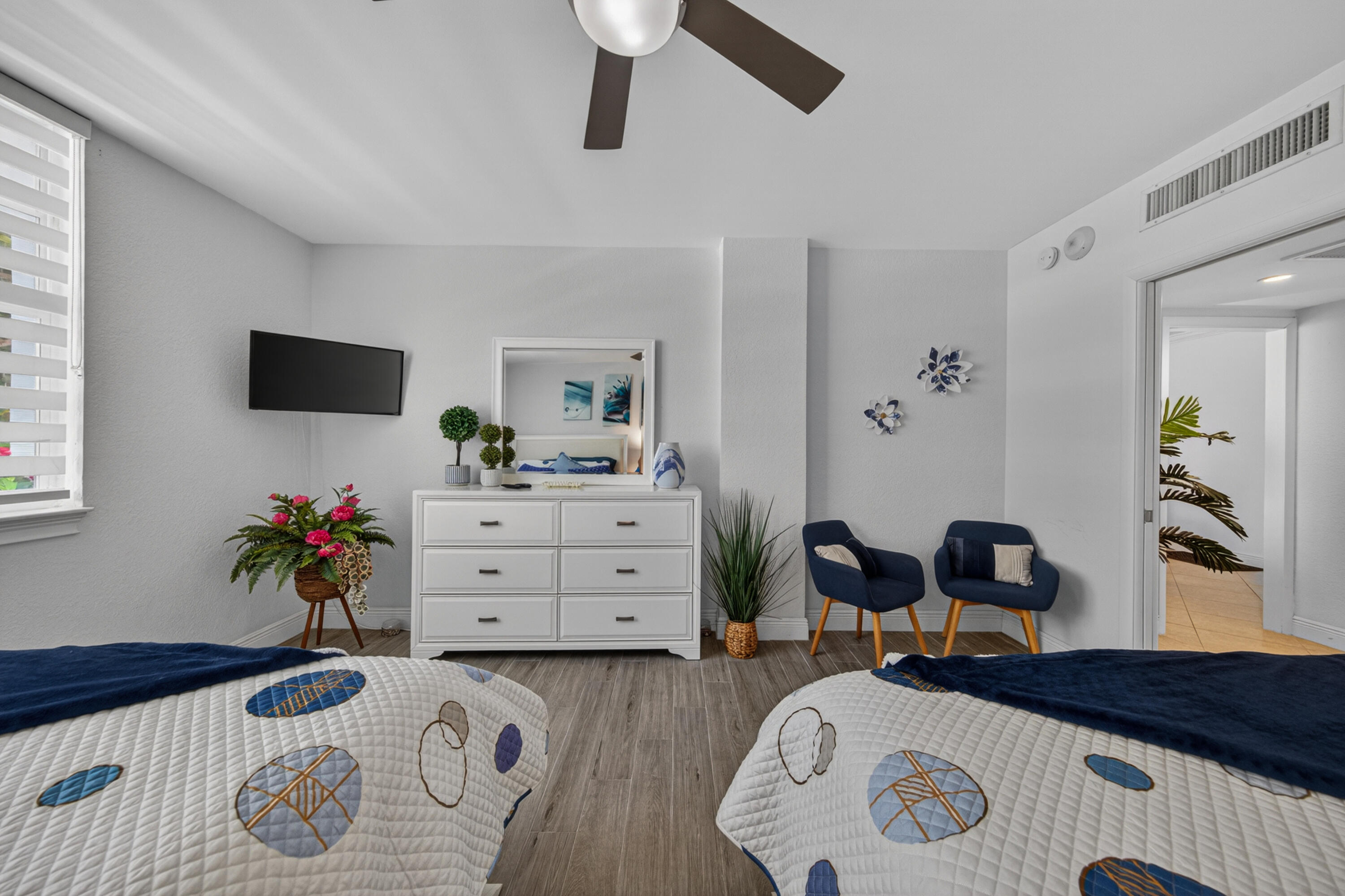 2851 South Ocean Boulevard, Unit 1N Boca Raton, FL 33432 - Photo 30 of 54 a bedroom with a bed and wooden floor