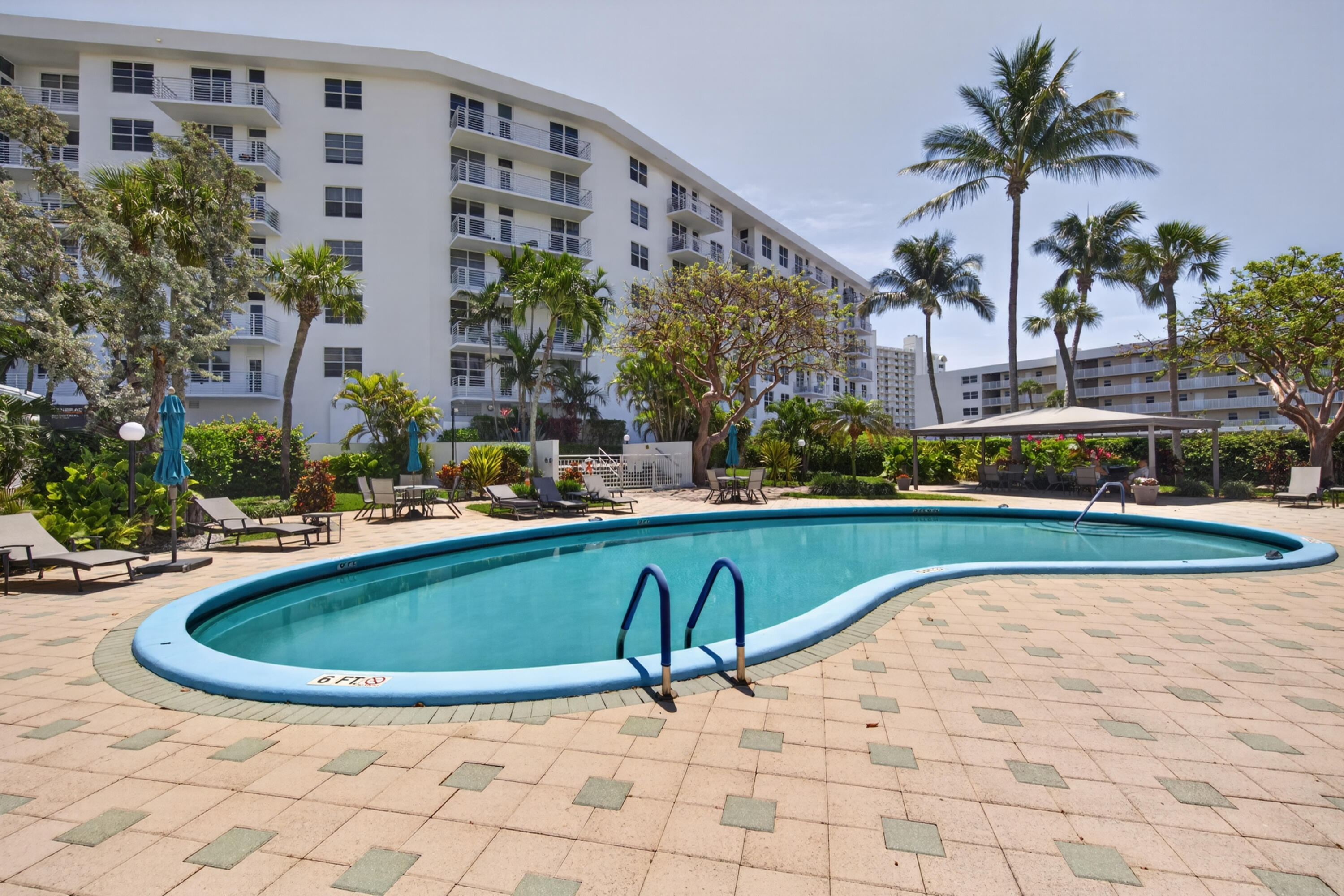 2851 South Ocean Boulevard, Unit 1N Boca Raton, FL 33432 - Photo 41 of 54 a view of swimming pool with outdoor seating and plants