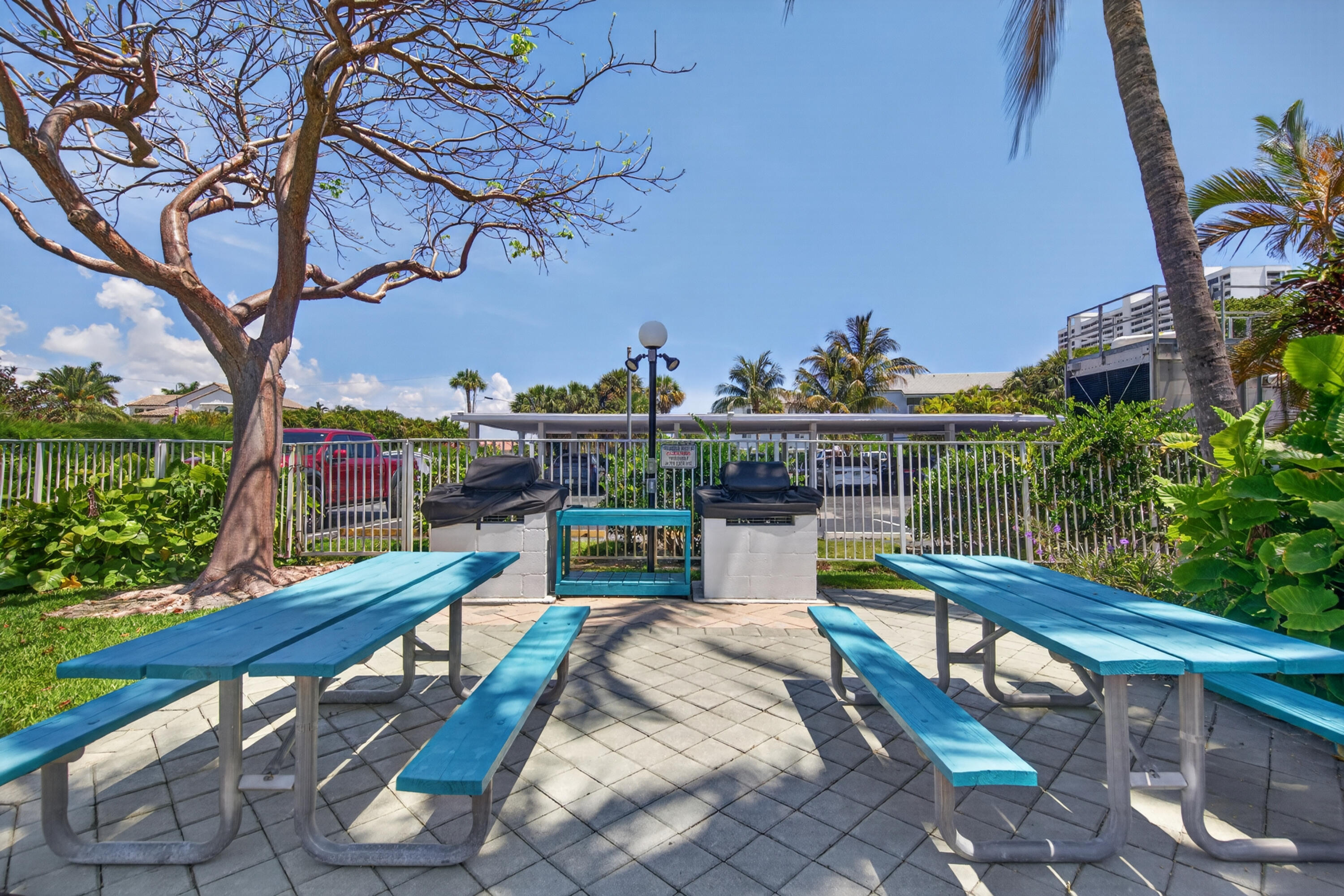 2851 South Ocean Boulevard, Unit 1N Boca Raton, FL 33432 - Photo 43 of 54 a view of a chairs and table in the terrace