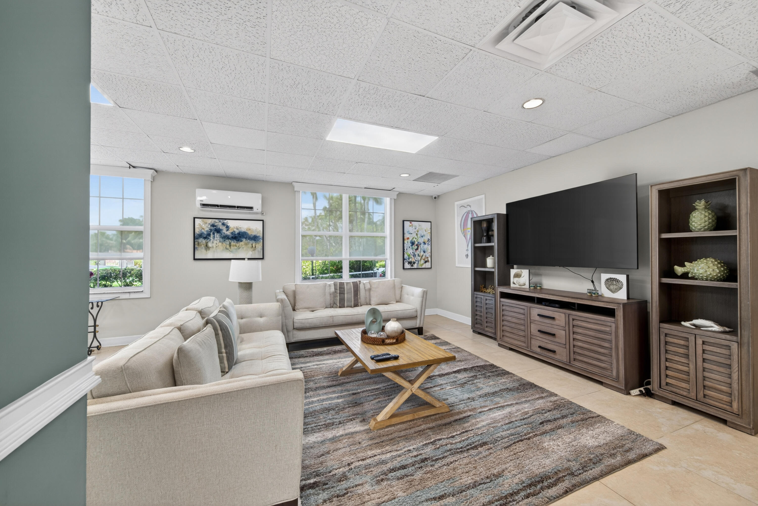 2851 South Ocean Boulevard, Unit 1N Boca Raton, FL 33432 - Photo 44 of 54 a living room with furniture and a flat screen tv