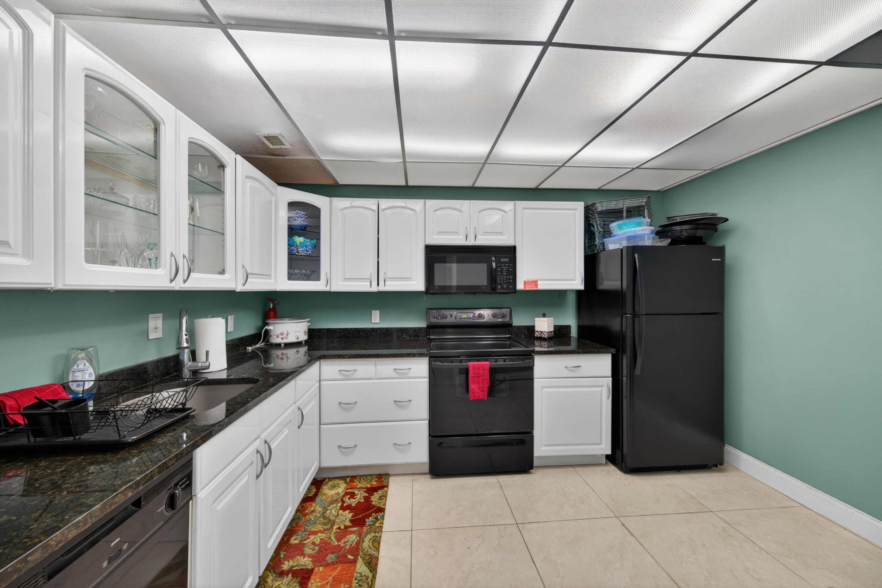 2851 South Ocean Boulevard, Unit 1N Boca Raton, FL 33432 - Photo 49 of 54 a kitchen with stainless steel appliances granite countertop a refrigerator a sink a stove and dishwasher