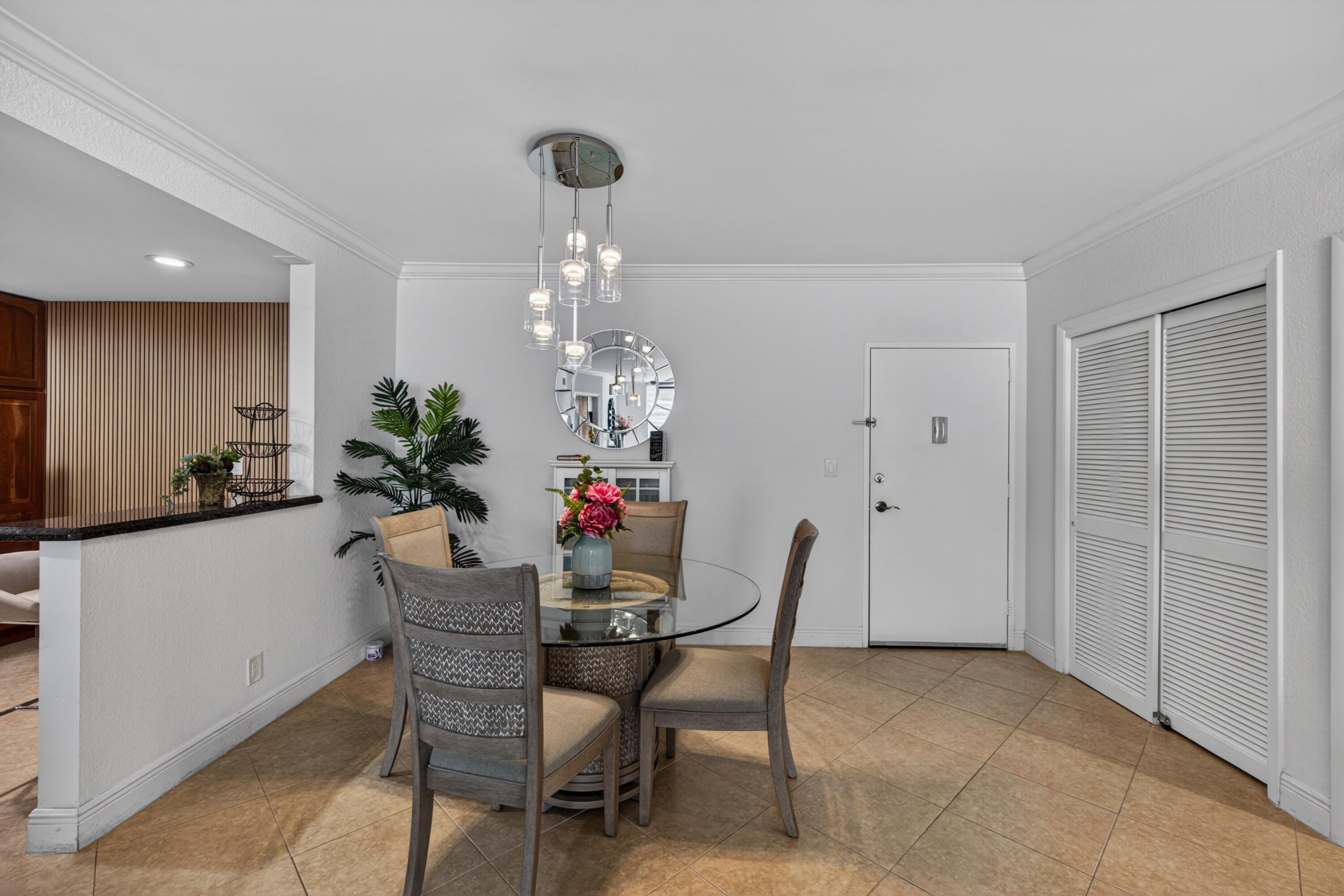 2851 South Ocean Boulevard, Unit 1N Boca Raton, FL 33432 - Photo 10 of 54 a dining room with furniture a chandelier and window