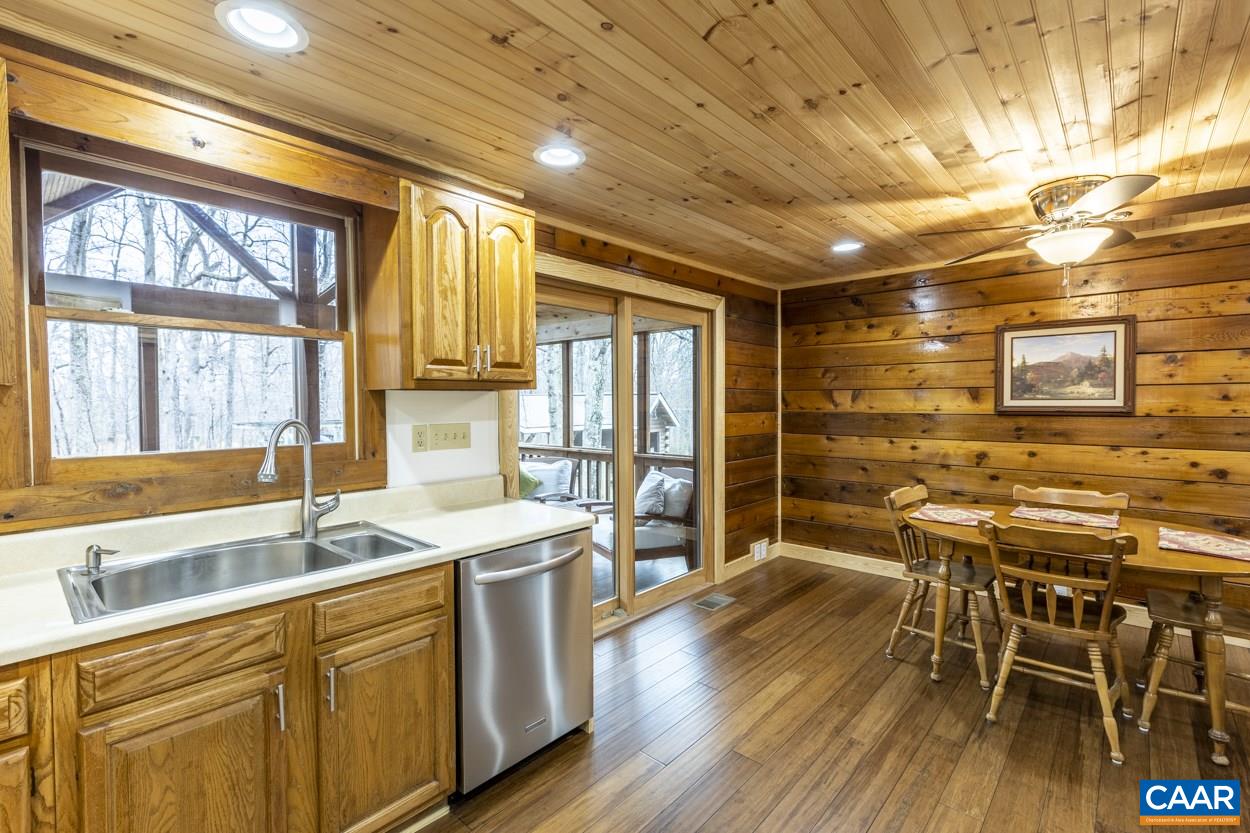 1151 Ridgeview Road Reva, VA 22735 - Photo 29 of 74 a kitchen with stainless steel appliances a table chairs and wooden floors