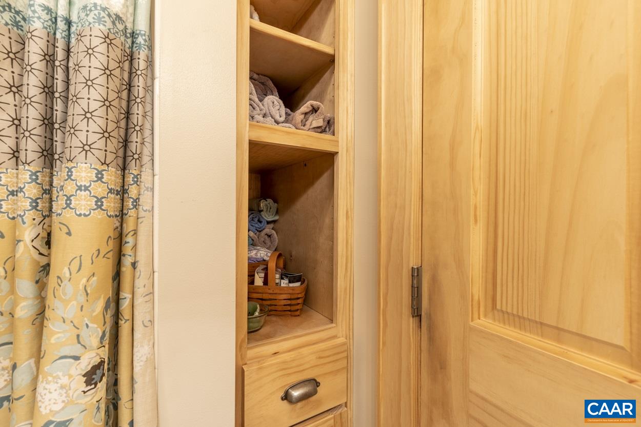 1151 Ridgeview Road Reva, VA 22735 - Photo 35 of 74 a view of walk in closet with clothes and shoes