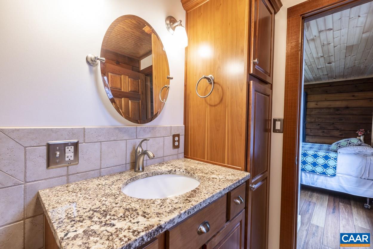 1151 Ridgeview Road Reva, VA 22735 - Photo 42 of 74 a bathroom with a sink and a mirror