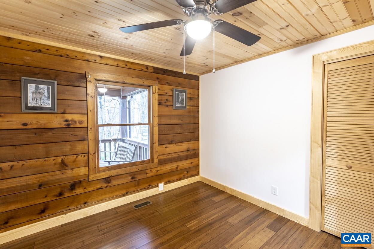 1151 Ridgeview Road Reva, VA 22735 - Photo 51 of 74 a view of an empty room with a window and wooden floor