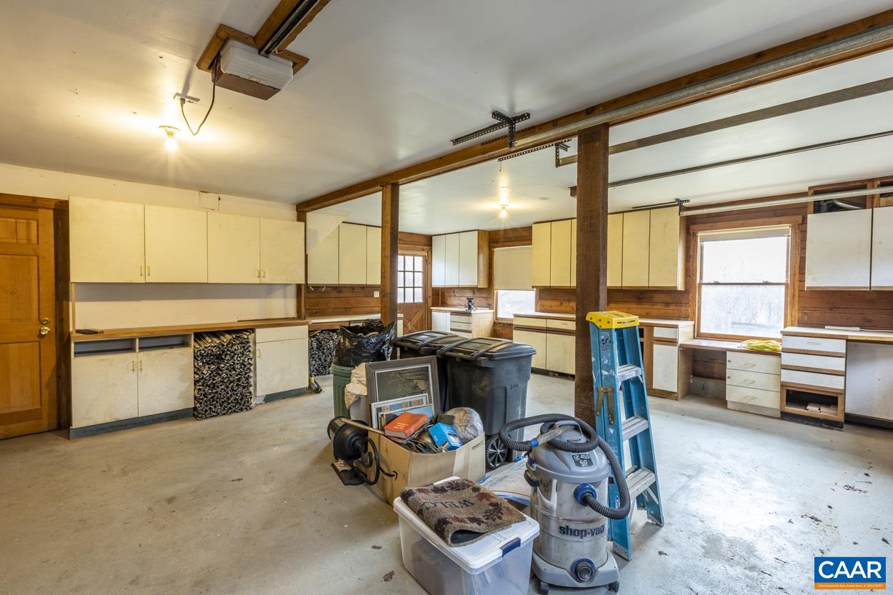 1151 Ridgeview Road Reva, VA 22735 - Photo 74 of 74 a kitchen with stainless steel appliances kitchen island granite countertop a stove and a view of living room