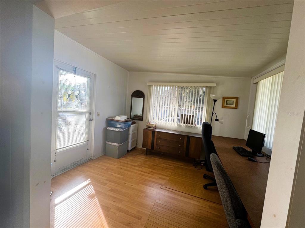 202 Aspen Circle Leesburg, FL 34748 - Photo 14 of 34 a bedroom with a bed and a window