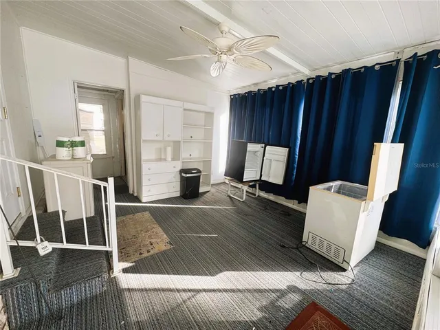 a utility room with cabinets washer and dryer