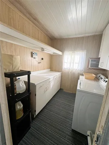 a view of a chairs and table in the balcony