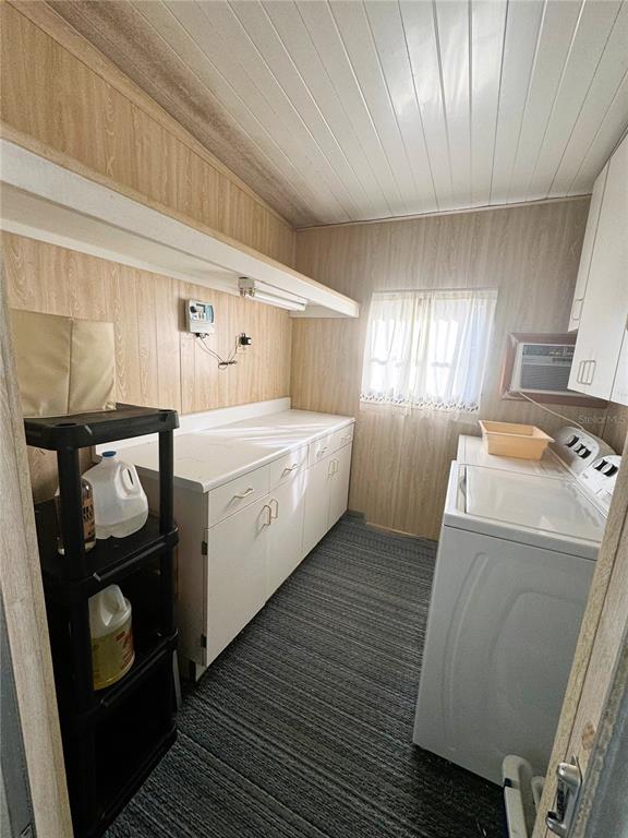 202 Aspen Circle Leesburg, FL 34748 - Photo 31 of 34 a room with a washing machine and wooden floor