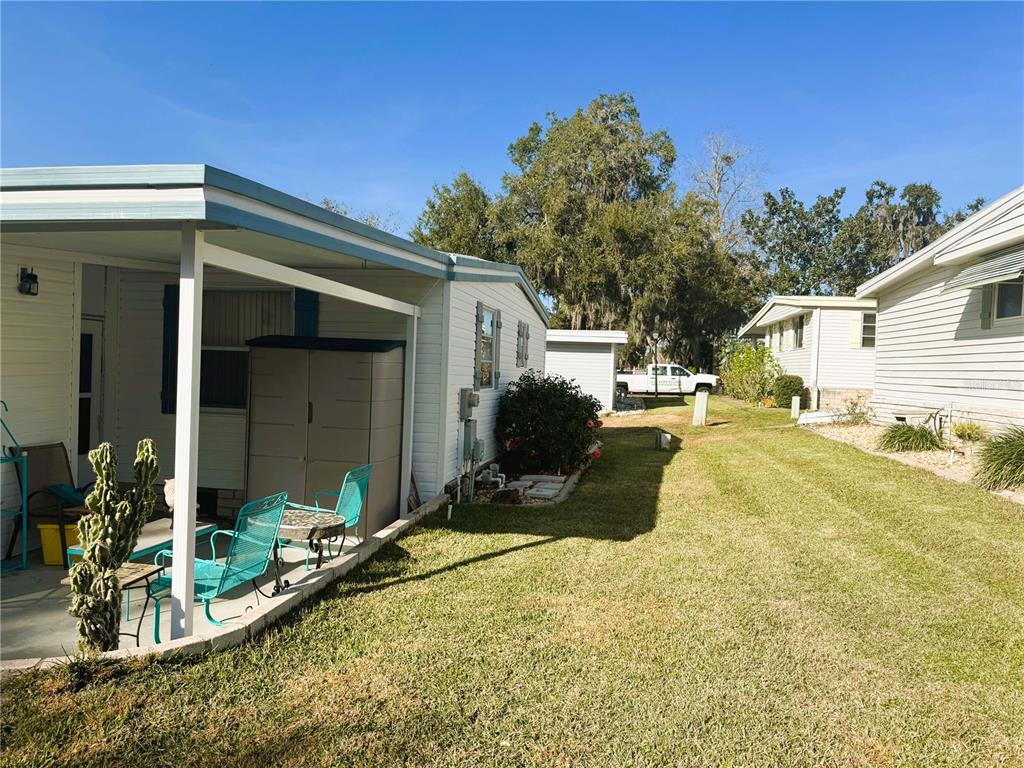 202 Aspen Circle Leesburg, FL 34748 - Photo 34 of 34 a view of a house with a patio
