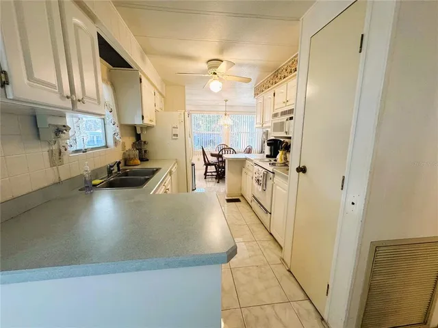 a view of a kitchen cabinets and wooden floor