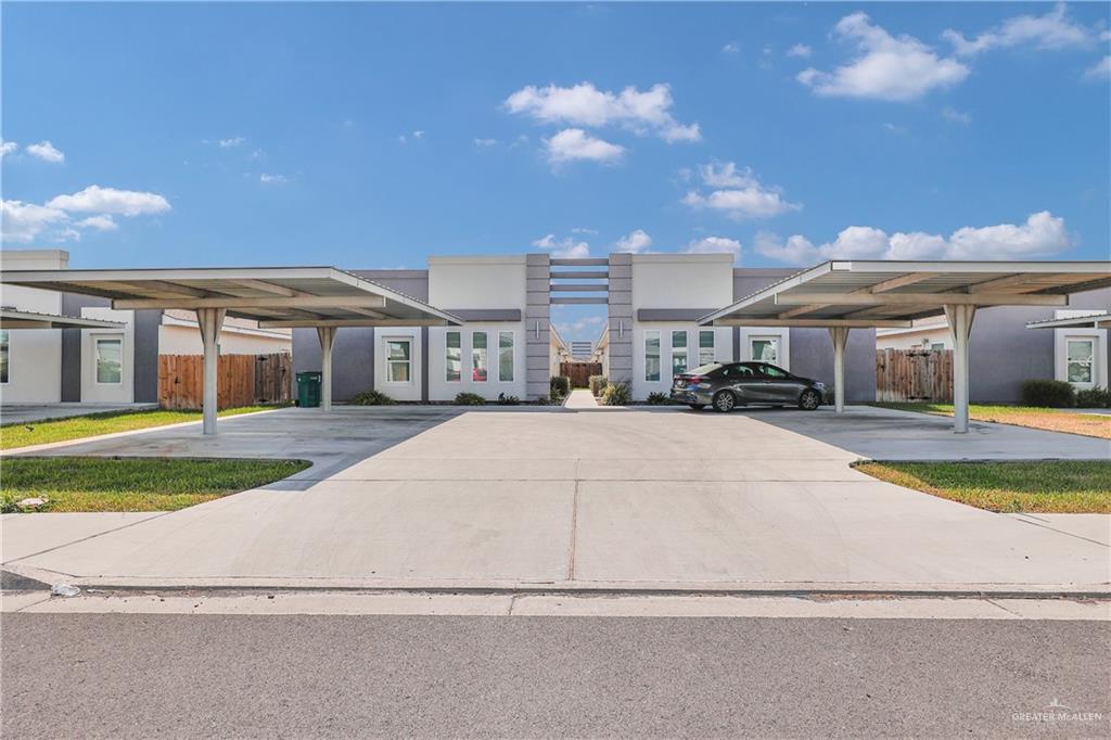 a view of multiple houses with a yard