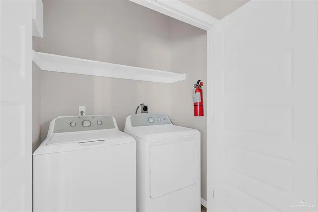 a utility room with dryer and washer
