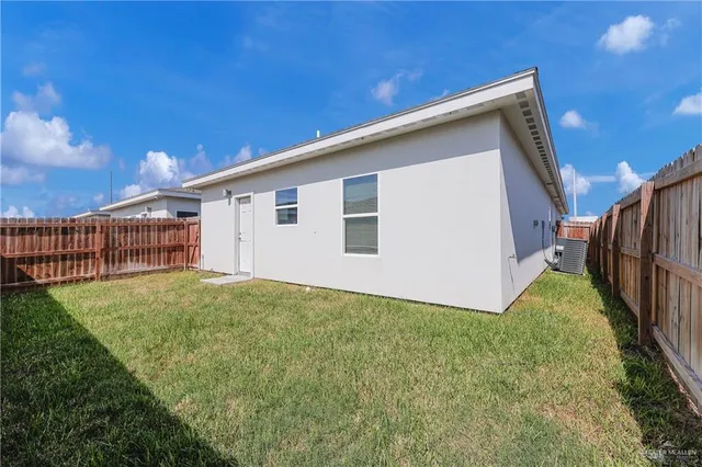 a view of a backyard with potted plants