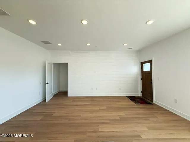 a kitchen with stainless steel appliances granite countertop a refrigerator sink and stove