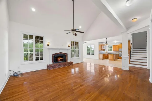 a kitchen with stainless steel appliances granite countertop sink stove and refrigerator