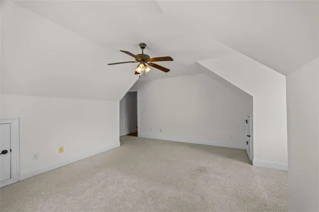 a view of a room with wooden walls