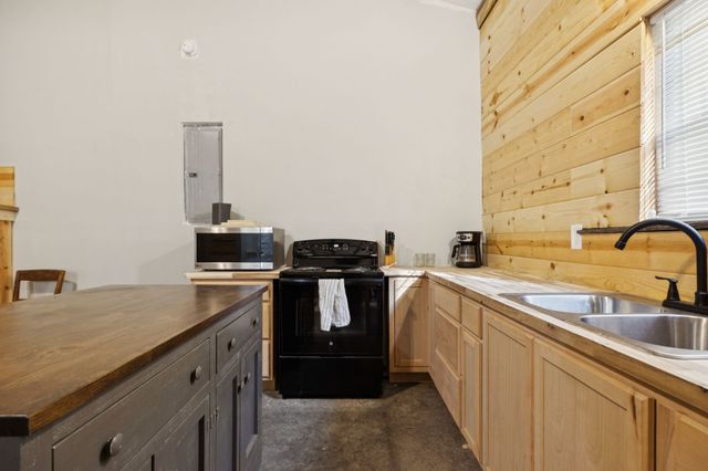 a kitchen with a sink and cabinets