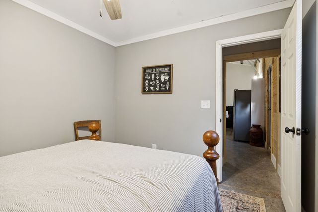 a bedroom with a bed and cabinets