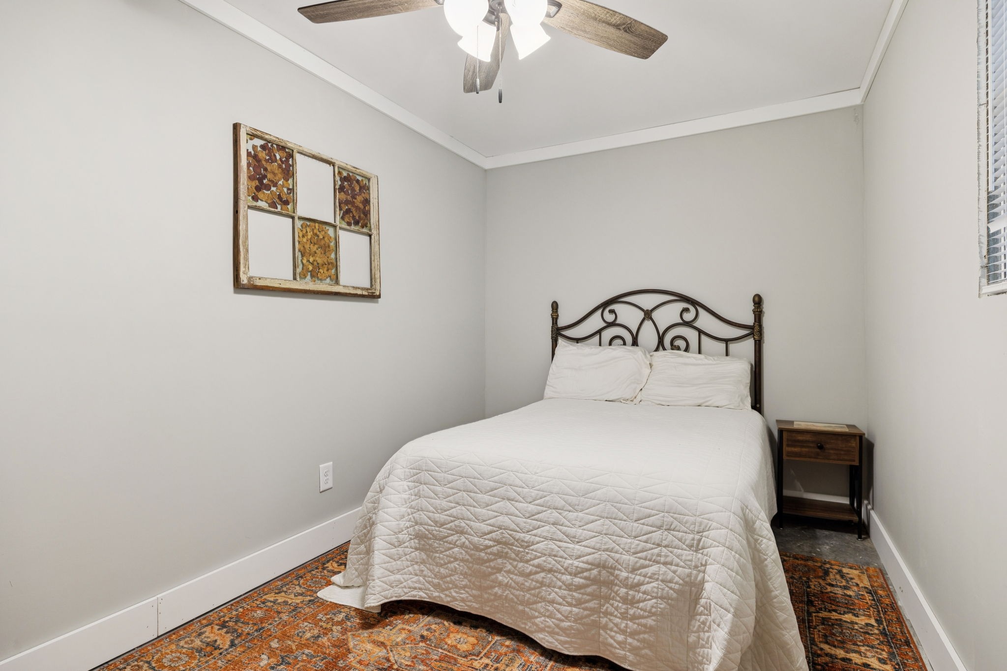 1399 Roberts Creek Road Waverly, TN 37185 - Photo 18 of 42 a bedroom with a bed and a chandelier